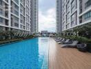 Outdoor swimming pool between tall residential buildings