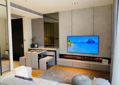 Modern living room with wall-mounted TV and built-in fireplace