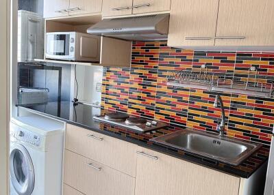 Modern kitchen with colorful backsplash