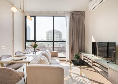 Modern living room with dining area and large window