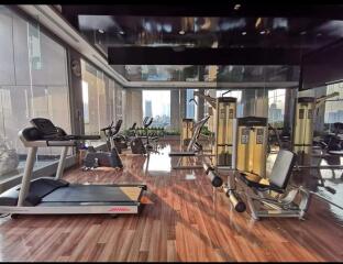 Luxurious home gym with modern equipment and city view