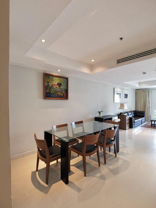 Spacious living area with a dining table and seating arrangement