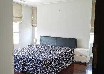 Neatly arranged bedroom with double bed and nightstands