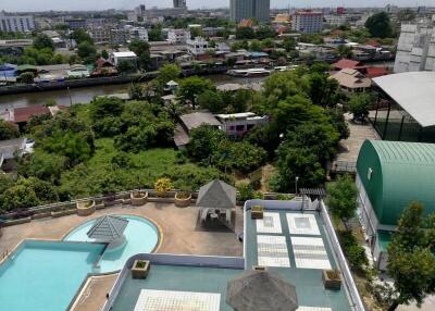 View from building showing rooftop pool and surrounding cityscape