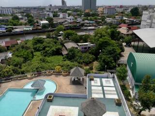 View from building showing rooftop pool and surrounding cityscape