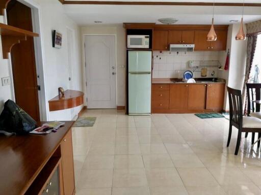 Kitchen with wooden cabinets and dining area