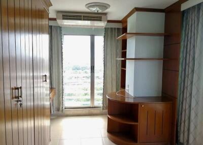 Bedroom with large wardrobe and window