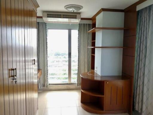 Bedroom with large wardrobe and window