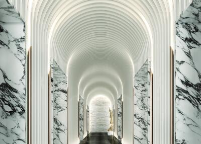 Modern corridor with marble walls and arches