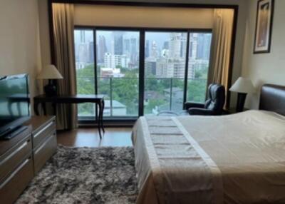 Spacious bedroom with city view