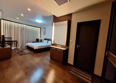 Spacious and well-lit bedroom with modern decor