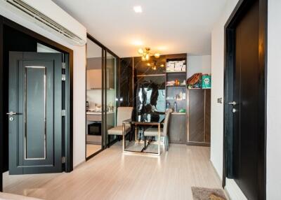 Modern dining area with adjacent kitchen