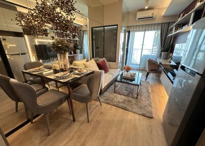 Modern living area with dining table and seating space