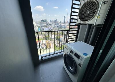 Laundry area with a view of the city