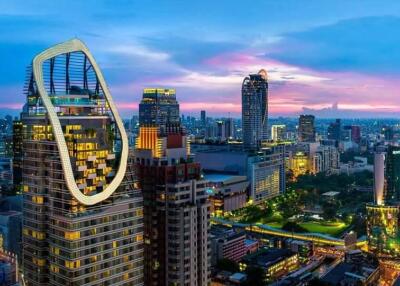 City skyline at dusk with modern high-rise buildings