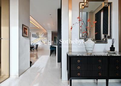 Elegant hallway leading to living and dining areas