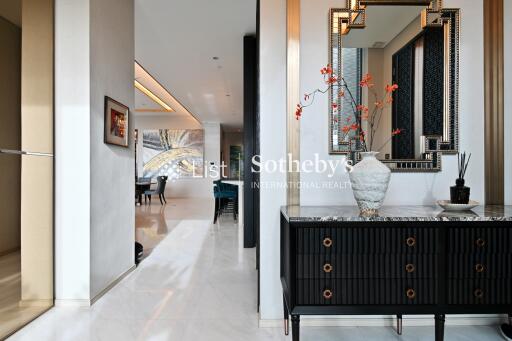 Elegant hallway leading to living and dining areas