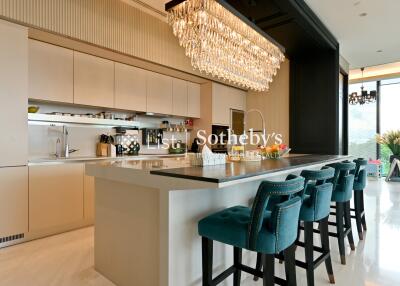 Modern kitchen with a large island and chandelier