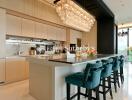 Modern kitchen with a large island and chandelier