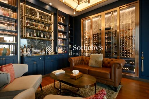 Luxurious living room with elegant furniture and a wine display