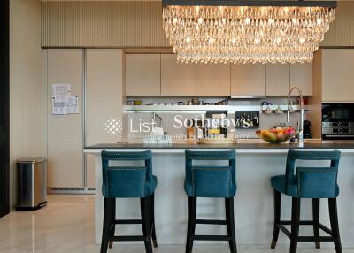 Modern kitchen with island and chandelier