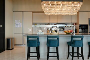 Modern kitchen with island and chandelier