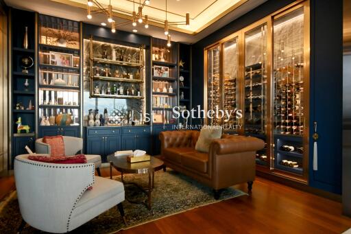 Luxurious living space with built-in bar and wine storage