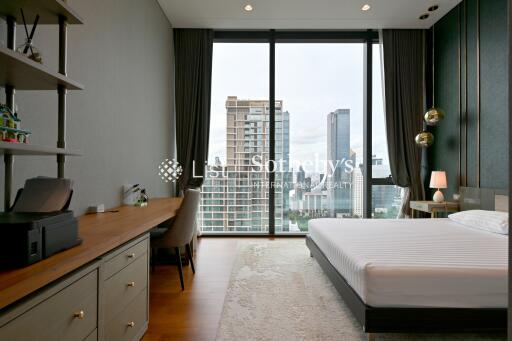 Modern bedroom with large city view windows