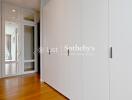 Spacious hallway with built-in wardrobes