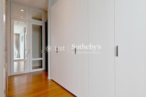 Spacious hallway with built-in wardrobes