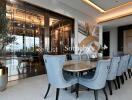 Modern dining room with large table, blue upholstered chairs, and sophisticated decor