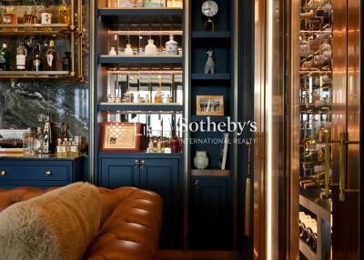 Bar area with wine storage and shelving in a luxurious living room