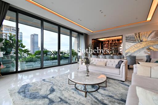 Spacious modern living room with large windows and city view