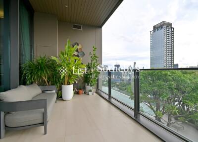 Spacious balcony with plants and city view