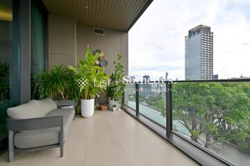 Spacious balcony with plants and city view