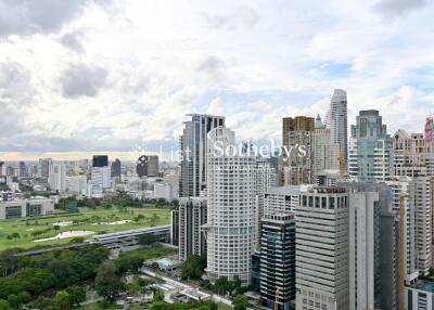 City skyline with view of multiple skyscrapers and a golf course