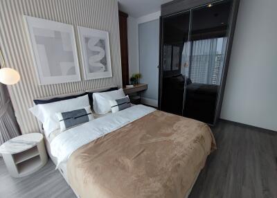 Modern bedroom with double bed and closet