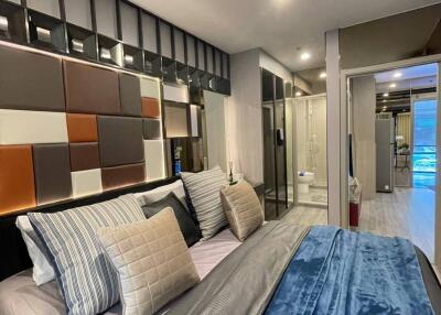 Modern bedroom with stylish decor and adjoining bathroom