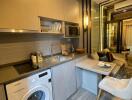 Compact kitchen with integrated laundry