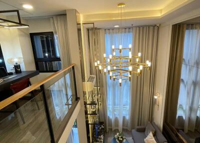 Modern Living Room with Chandelier and Mezzanine