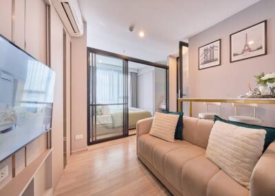 Modern living room with a view into a bedroom