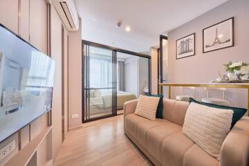 Modern living room with a view into a bedroom