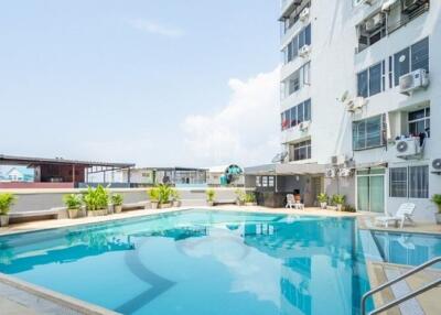 Outdoor swimming pool with surrounding buildings