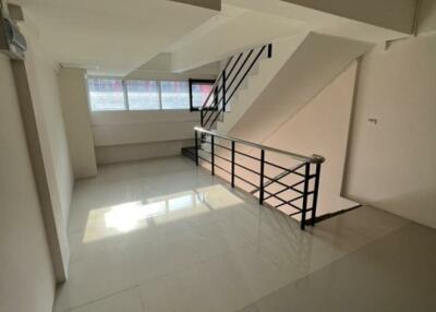 Stairwell with natural light and modern railing