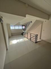 Stairwell with natural light and modern railing