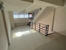 Stairwell with natural light and modern railing