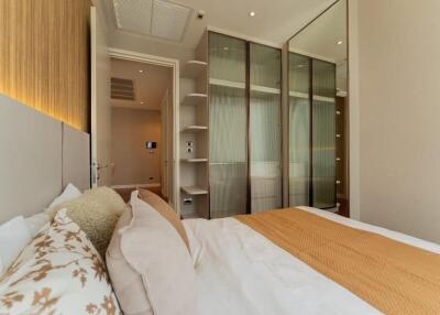 Modern bedroom with large bed and built-in wardrobe