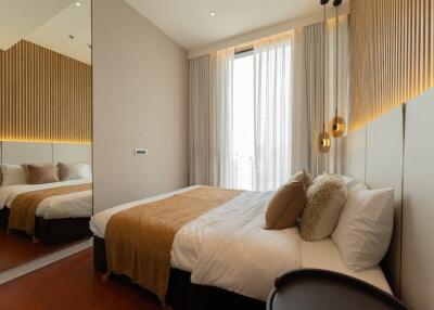 Modern bedroom with double bed and decorative lighting