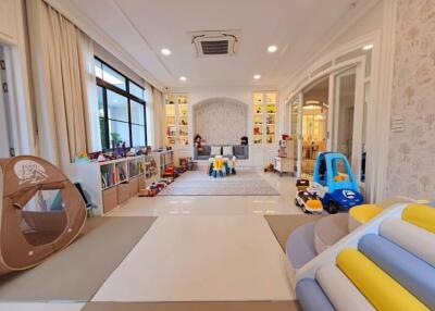 Spacious living room with toys and play area for children