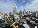 Panoramic view of a city with high-rise buildings and greenery